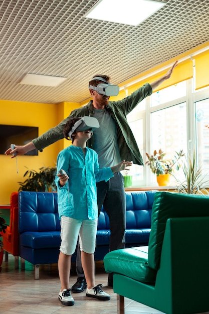 A group of people in a virtual reality showroom, all wearing VR headsets and looking around with expressions of awe and excitement. The showroom displays various furniture items and home decor, all rendered in high detail. The lighting is soft and inviting.