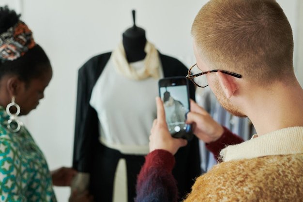A split-screen image showing a user interacting with a virtual stylist app on one side, and a store associate helping a customer with personalized recommendations based on AI insights on the other.